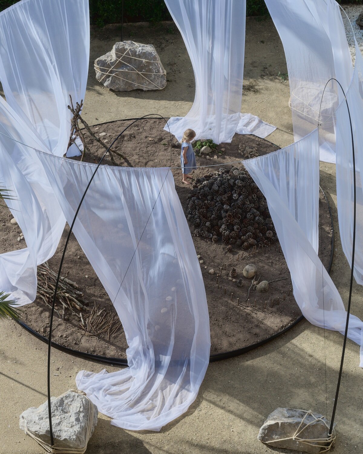 translucent drapes encircle forest floor for nami nami's concéntrico installation in spain