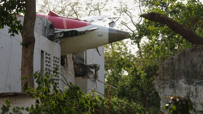 Rescuers work at the site of an airplane that crashed in India's northwestern city of Ahmedabad in Gujarat state.