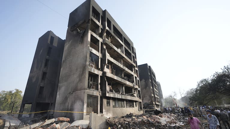 Rescuers work at the site of an airplane that crashed in India's northwestern city of Ahmedabad in Gujarat state.