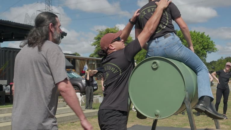 Stunt student Puriri Koria attempts to pull a clasmate off the 'horse'.