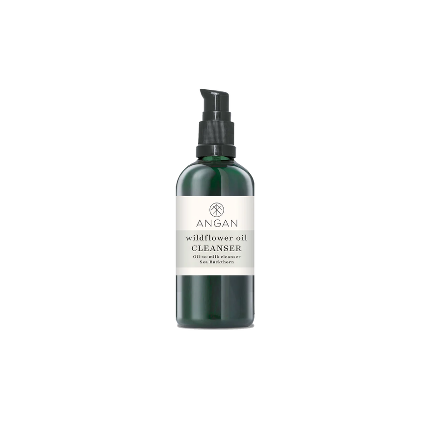 The Angan Wildflower Oil Cleanser comes in a sleek dark green pump bottle with a white label, reflecting its clean, natural formulation.
