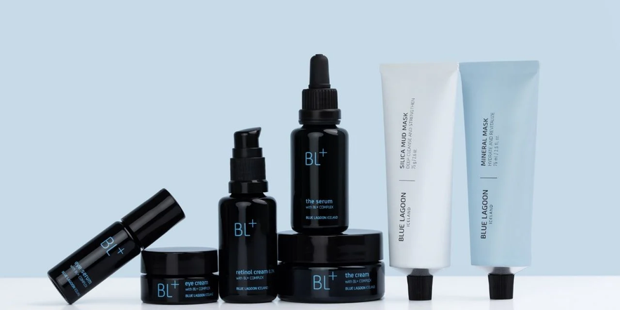 Blue Lagoon BL+ Skincare line features black jars and bottles paired with light blue and white tubes.