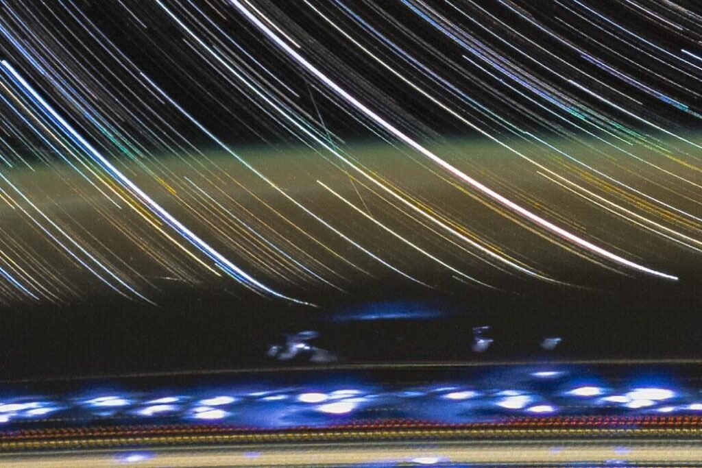Atmospheric warping of star trails as seen from ISS, details in comments.