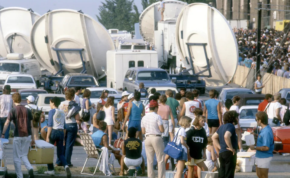 Music lovers surround the exterior of the JFK Stadium in Philadelphia for the Live Aid Concert.