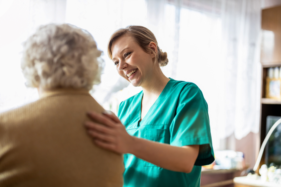 A nurse helping a patient.
