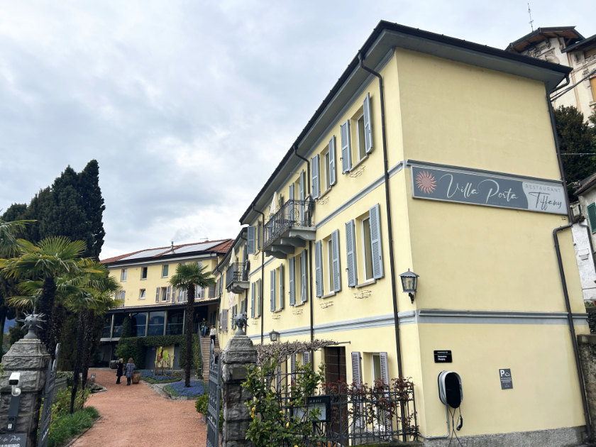 Exterior of a hotel with a pale yellow finish.