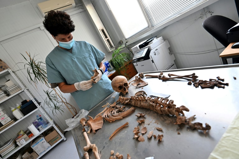 Bosnia marks 30 years since Srebrenica massacre Forensic expert Dragana Vucetic works on humain remains from the Srebrenica massacre of 8,000 Muslim men and boys at the International Commission on Missing Persons laboratory in Tuzla (ELVIS BARUKCIC)