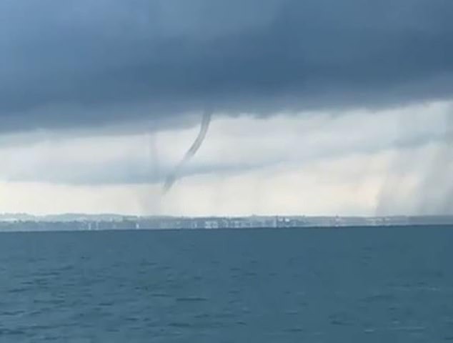 In Switzerland, a fisherman captured a video of a spectacular waterspout spiralling high into the clouds over Lake Constance