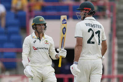 Australia's Alex Carey celebrates with partner Beau Webster scoring a half-century against West Indies. (AP Photo) WI vs AUS 2nd Test: Carey, Webster shine again as Australia rally from collapse to post 286