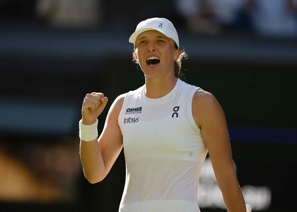 Iga Swiatek of Poland celebrates winning her match against Belinda Bencic of Switzerland on day 11 at All England Lawn Tennis and Croquet Club. © Susan Mullane-Imagn Images