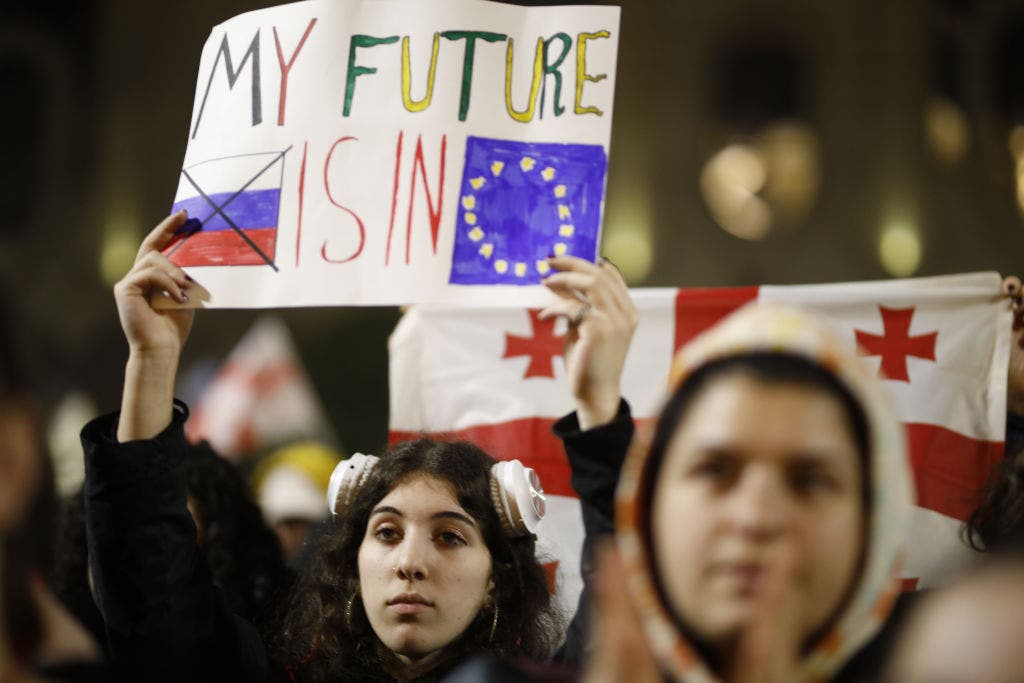 Former Soviet republic of Georgia sees ruling party cave to massive street protests as it seeks closer EU ties
