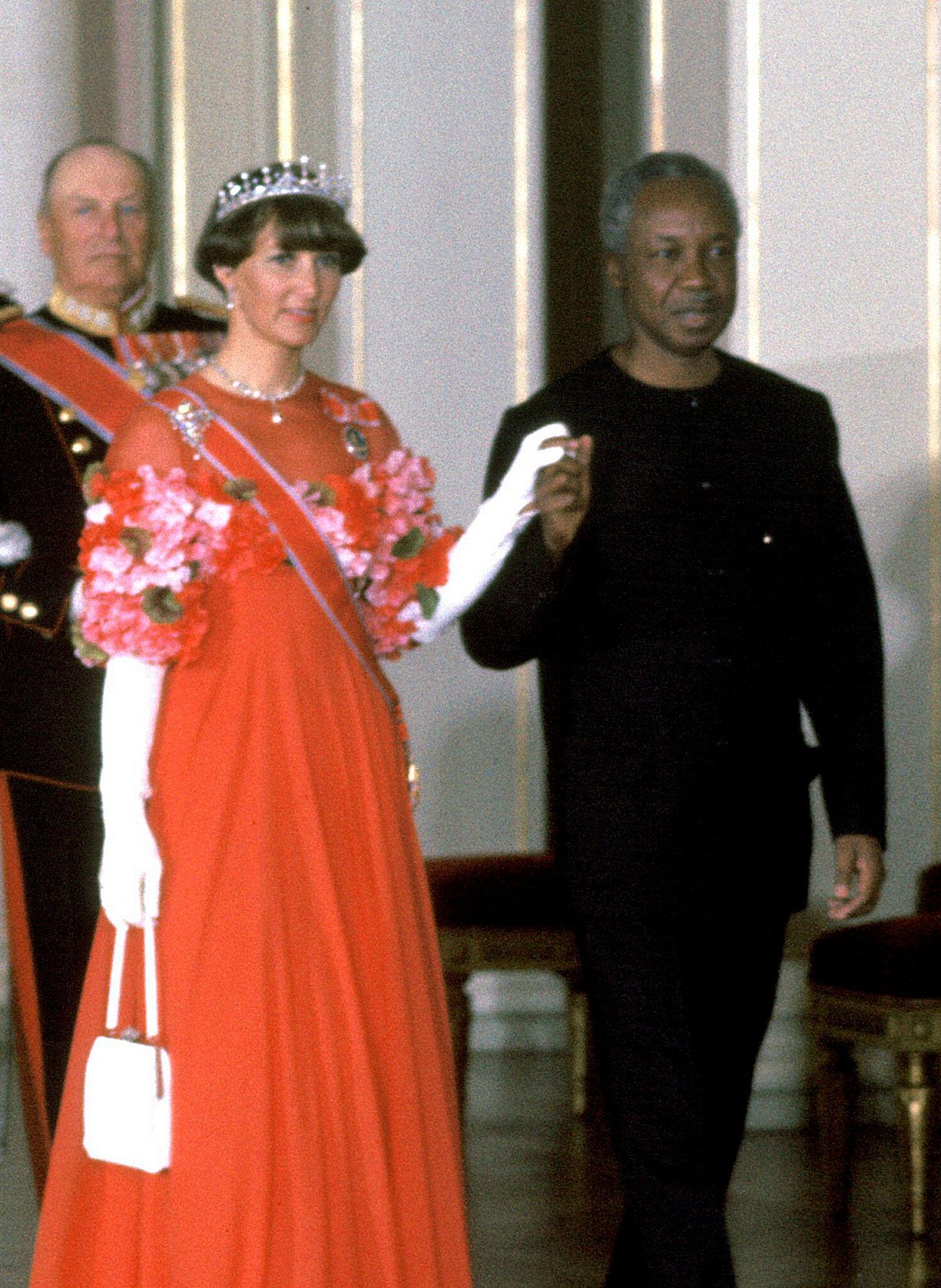 The Crown Princess of Norway attends a state banquet in honor of the visiting President of Tanzania at the Royal Palace in Oslo on April 28, 1976 (NTB/Alamy)