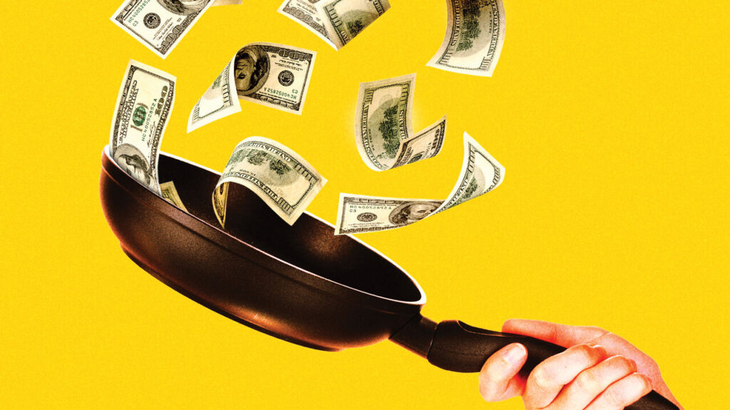 Bit by bit, the world economy’s resilience is being worn away A hand holding a frying pan with U.S. hundred-dollar bills flying out of it against a bright yellow background