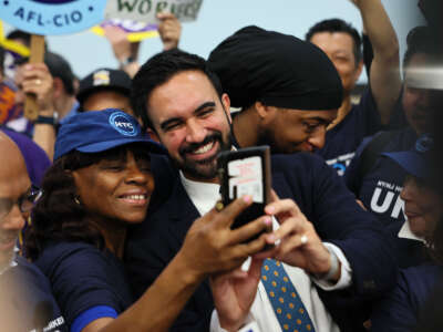 New York Mayoral Candidate Zohran Mamdani takes photos with supporters during a press conference at the Hotel & Gaming Trades Council building on July 2, 2025, in New York City.