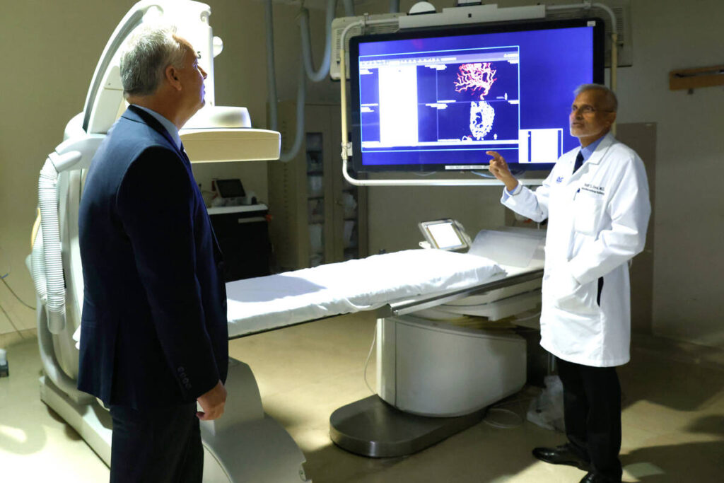 Dr. Baljit Deol, right, an interventional radiology specialist at the University Medical Center ...