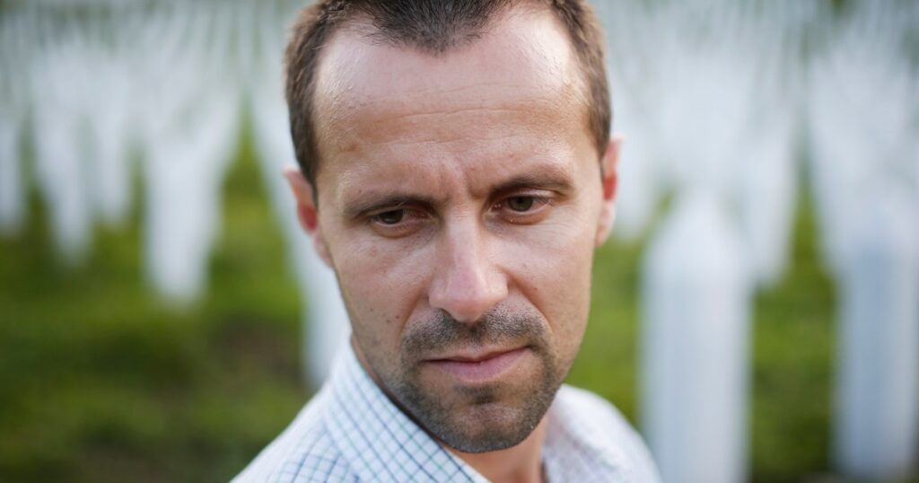 He survived a mass execution at 17. Now he's fighting disinformation and denialism.