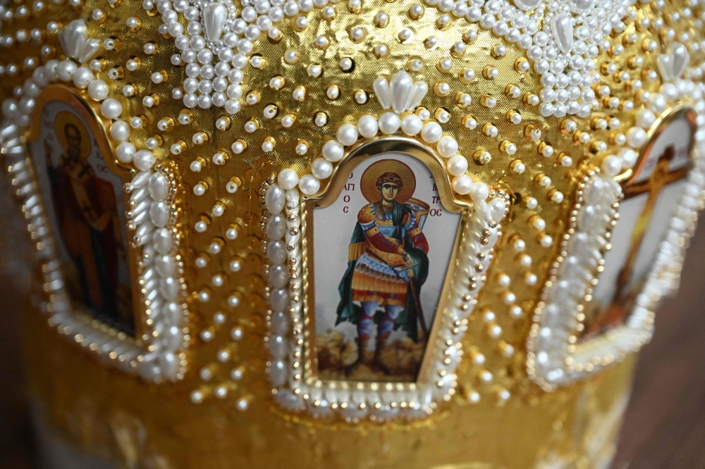 Decorated with vibrant colours, gold embroidery and jewels, every mitre weighs between one and two kilograms (2.2 and 4.4 pounds).  — AFP pic