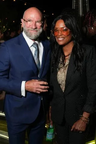 Presley Ann / Shutterstock for Entertainment Weekly Graham McTavish and Aisha Tyler at at the 2025 'Entertainment Weekly' Comic-Con bash in San Diego