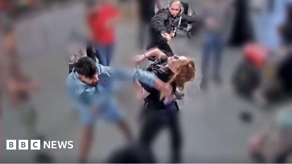 Jury shown CCTV of alleged assault on police at Manchester airport