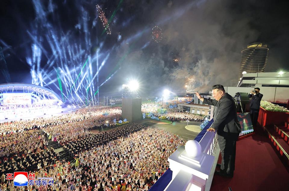 Kim Jong Un waves to a crowd at an opening ceremony for the resort (KCNA VIA KNS/AFP via Getty)
