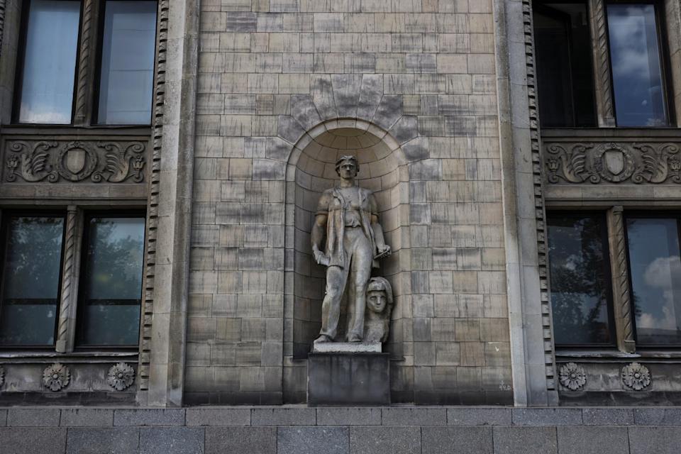 A socialist realist sculpture is seen on the facade of the Palace of Culture and Science in Warsaw (Reuters)