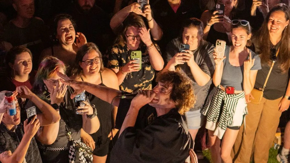 Tyson Ritter jumping atop a storage crate during a House Party Tour show in Columbia, Missouri, in May. - Russ Bray
