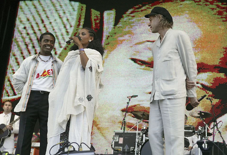 24-year-old student Birhan Woldu, former Ethiopian famine victim and the inspiration for Live Aid 1985, speaks on stage as Sir Bob Geldof looks on during "Live 8 London" in Hyde Park on July 2, 2005, in London, England.