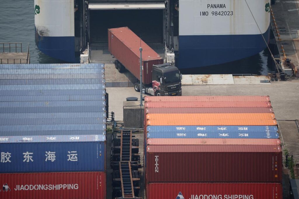 A truck unloads a shipping container at Pyeongtaek port in Pyeongtaek, South Korea, July 8, 2025.    REUTERS/Kim Hong-Ji