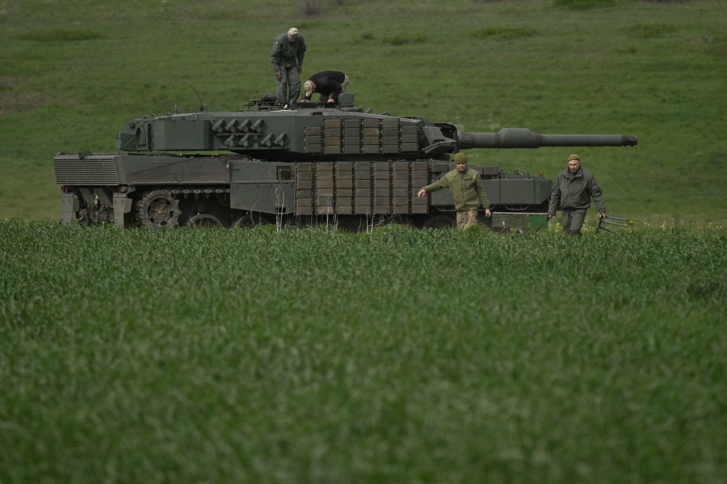 Members of a tank crew of the Ukrainian 33rd Separate Mechanized Brigade take part in a field training exercise with a Leopard 2A4 tank at an undisclosed location in Ukraine, on April 30, 2025. (Source: Getty Images)