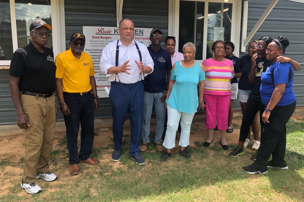 Sierra Club Executive Director Ben Jealous poses with Dr. Robert Bullard, Pastor Timothy Williams and other members of the Shiloh community in south Alabama. Credit: Courtesy of Living on Earth