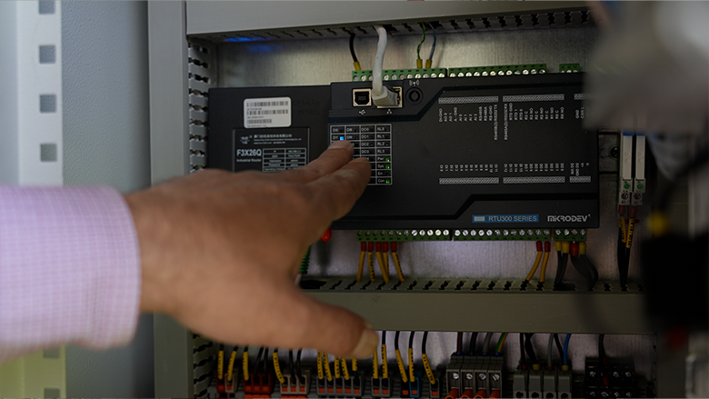 An administrator at a vocational school in Ankara demonstrates the substation%27s remote monitoring system—part of energy effic