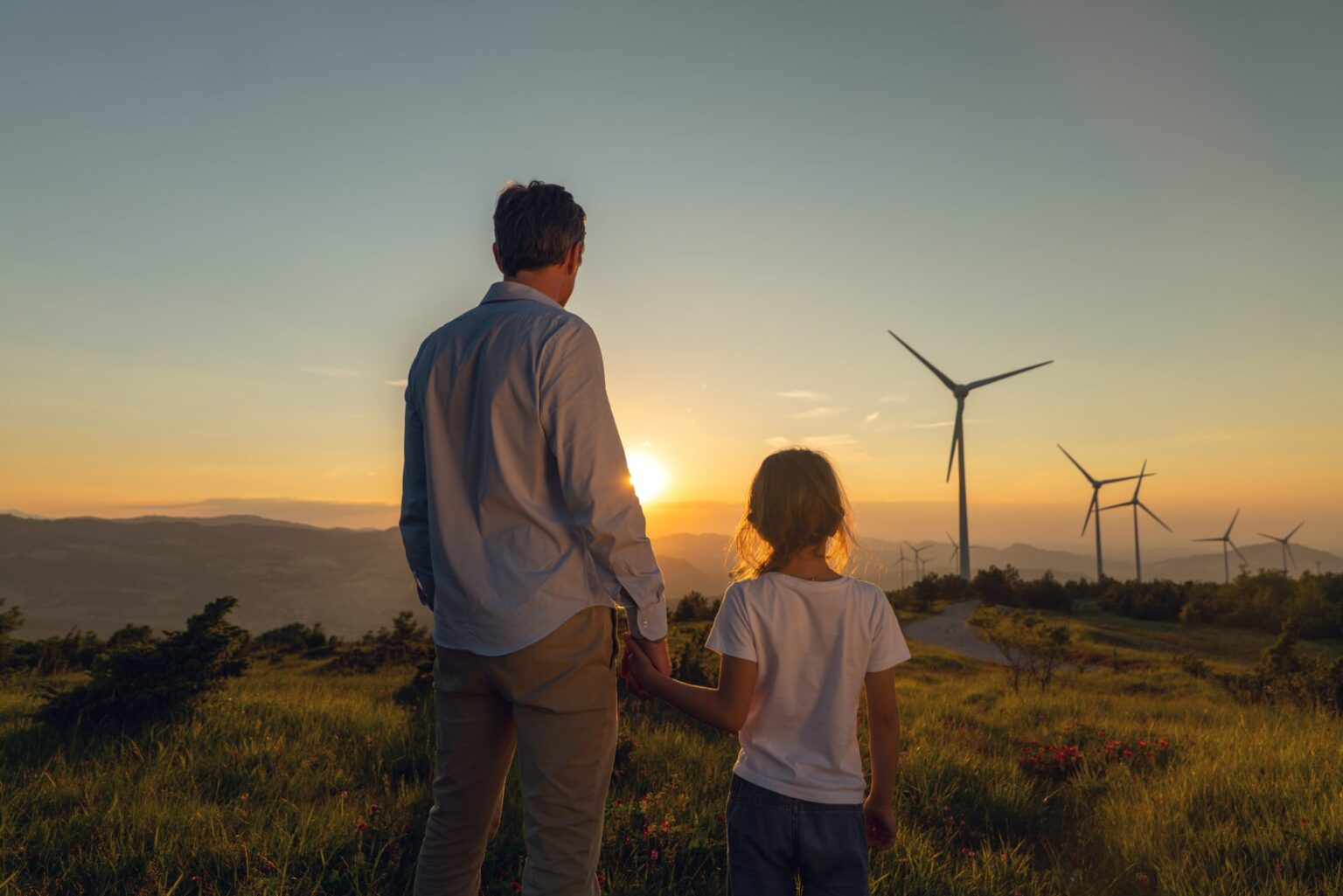 Father, daughter, and wind turbines