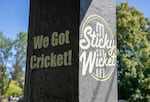 Sticky Wicket’s slogan “We Got Cricket!” outside of their pub in Portland, Ore., July 11, 2025. According to its owner, Sticky Wicket is the only cricket-themed sports bar in the area. 