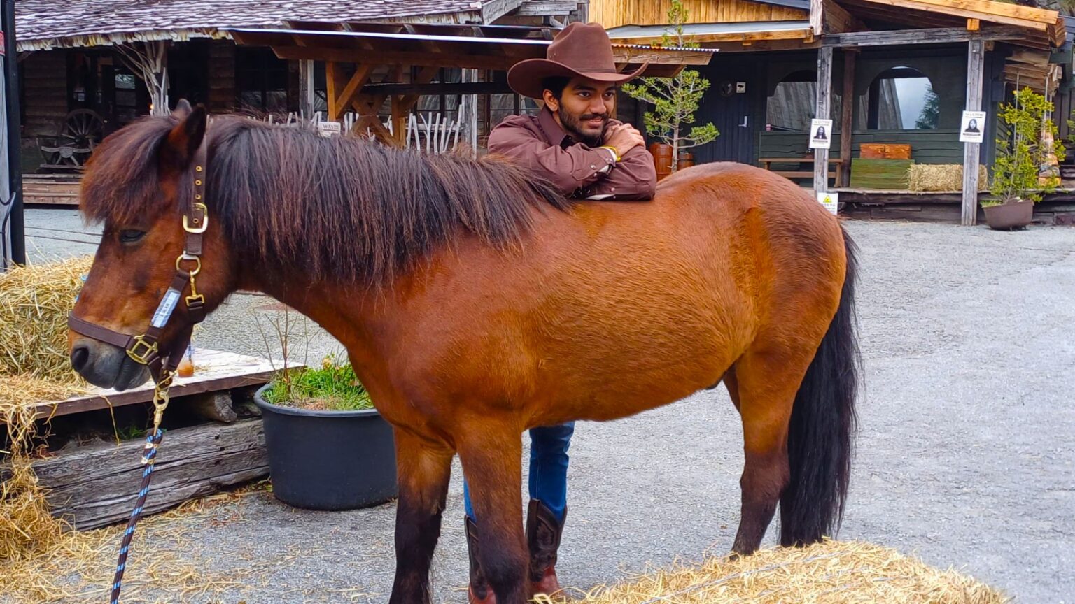 Vishy Anand grades Gukesh after Norway Chess: ‘He deserved a D, but I’ll give him a B… he got a lot of answers correct’ | Chess News World chess champion Gukesh D poses with a horse during the Norway Chess Games day at the recent Norway Chess tournament in Stavanger. (Express Photo by Amit Kamath)