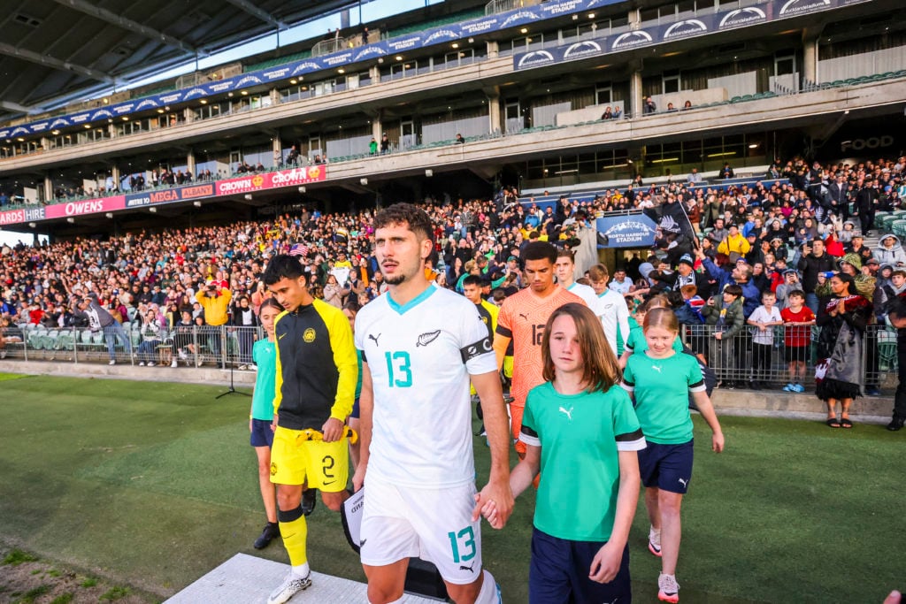 New Zealand captain Liberato Cacace leading his team out against Malaysia.