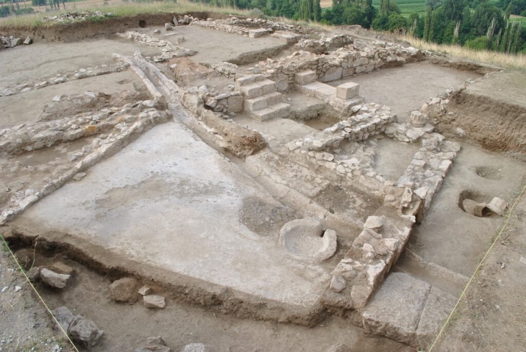 A particularly notable object: a locally made ceramic sherd inscribed with a Greek vulgar graffito ("Ψωλή κύ..."), exemplifying what scholars term aporretic inscriptions. Credit: Courtesy of Dejan Gjorgjievski