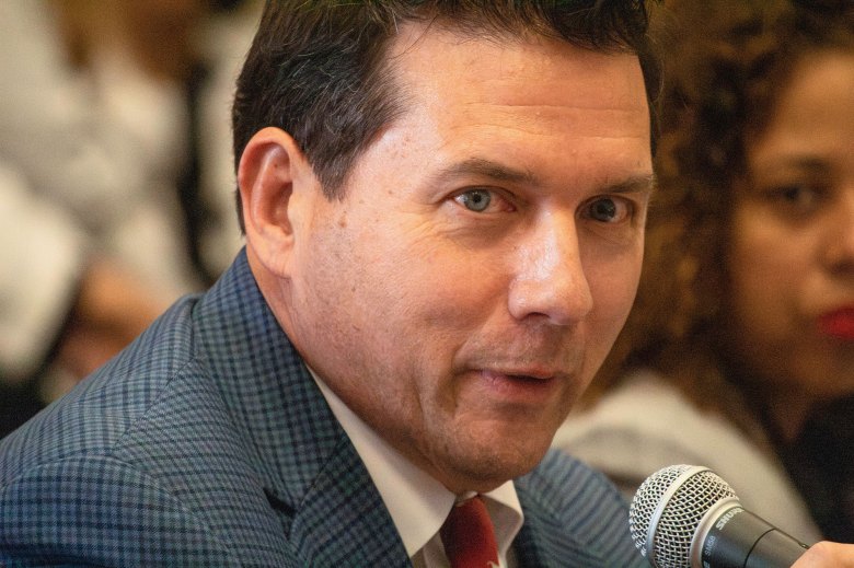 A man speaks into a microphone