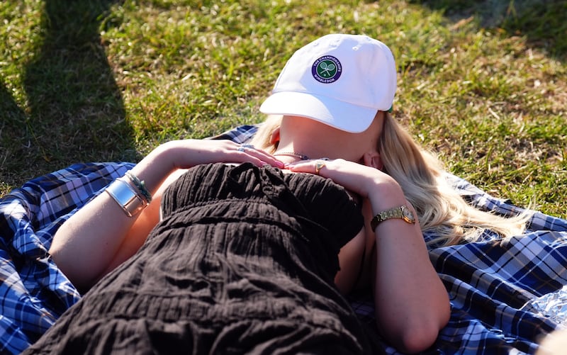A spectator sporting a Wimbledon cap on day two of the 2025 Wimbledon Championships. Photograph: Mike Egerton/PA