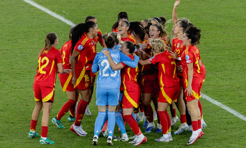Spain players celebrate on the pitch after defeating Germany in the UEFA Women's Euro 2025 semifinal in Zurich, Switzerland.