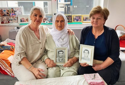 Suhra Malic, center, with her daughter Suada (left) and her daughter-in-law, widow Foada Malic, with photos of Suhra's two sons, killed during the genocide, on July 9 at the Srebrenica nursing home supported by the International Solidarity Fund.
