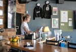 Employee of the Sticky Wicket, Allison Clark, works behind the bar.