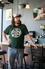 Michael Rasko, owner of Sticky Wicket stands in front of the bar of his pub in Portland, Ore., July 11, 2025.