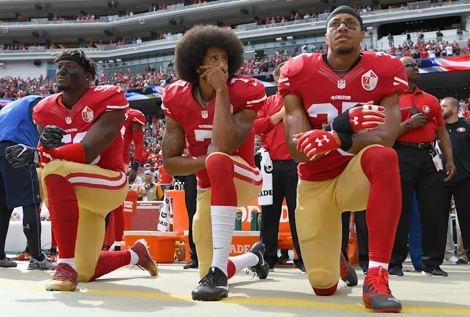 SANTA CLARA, CA - OCTOBER 02:  (L-R) Eli Harold #58, Colin Kaepernick #7 and Eric Reid #35 of the San Francisco 49ers kneel on the sideline during the National Anthem prior to the game against the Dallas Cowboys at Levi's Stadium on October 2, 2016 in Santa Clara, California.  (Photo by Thearon W. Henderson/Getty Images)