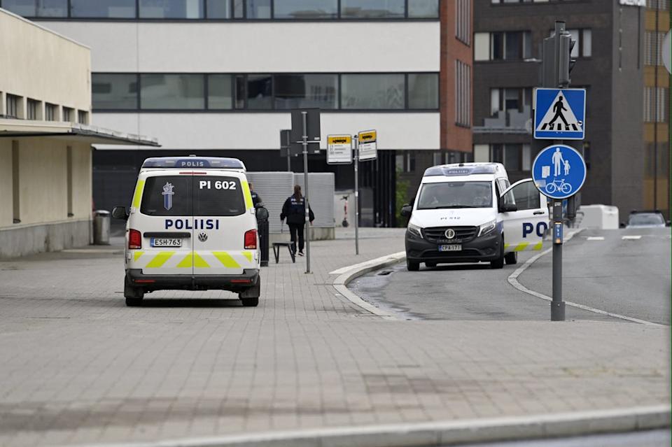 Police vehicles at the scene following the stabbing in Finland (Lehtikuva/AFP via Getty Images)