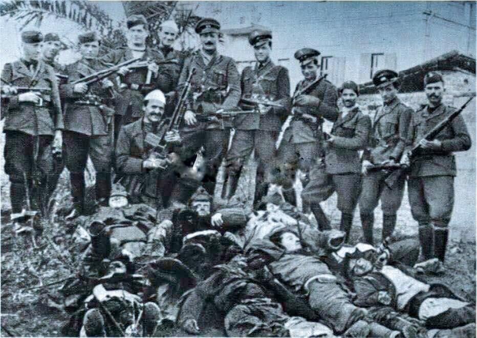 Albanian Nationalists posing with Chetnik/Partisan Corpses, Novi Pazar, 1941.