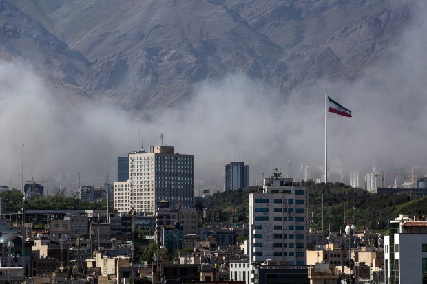 Smoke rises during an Israeli air strike in Tehran on June 18, 2025. (Arash Khamooshi/The New York Times)