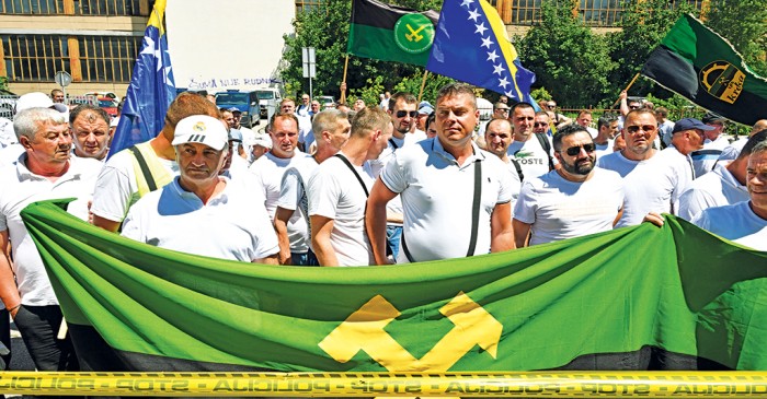 New Age | Bosnia miners get back-pay promise after protest