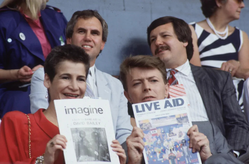 David Bowie and his PA, Corinne 'Coco' Schwab at the Live Aid benefit concert at Wembley Stadium