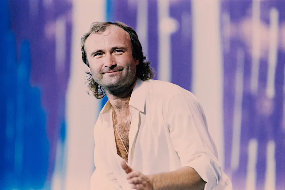 British singer Phil Collins performs on stage during the first Live Aid concert at JFK Stadium.