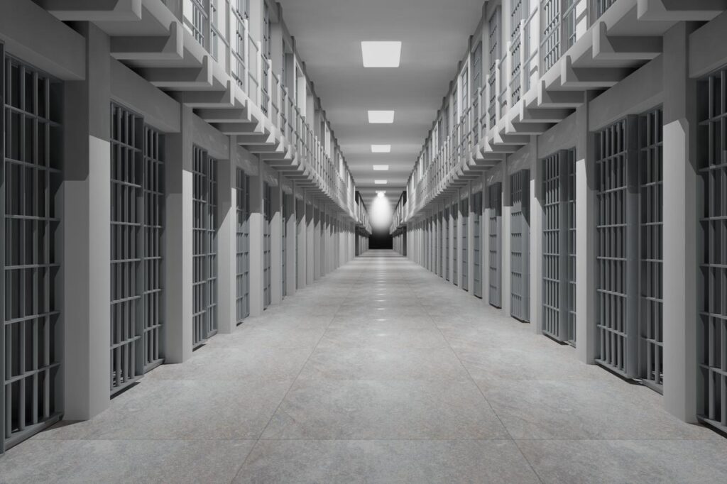 Fire erupts in Greece’s Volos prison after inmate fight, 4 hospitalized Rows of prison cells line prison interior. (Adobe Stock Photo)